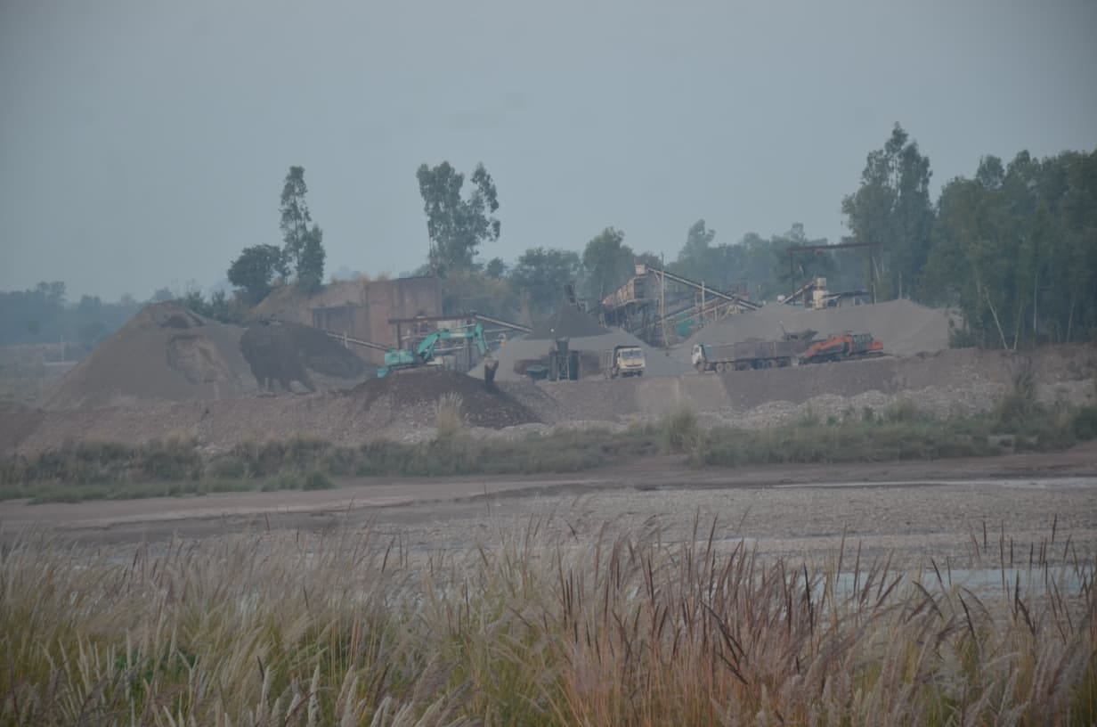 Stone crushers roaring in the middle of rivers and ravines