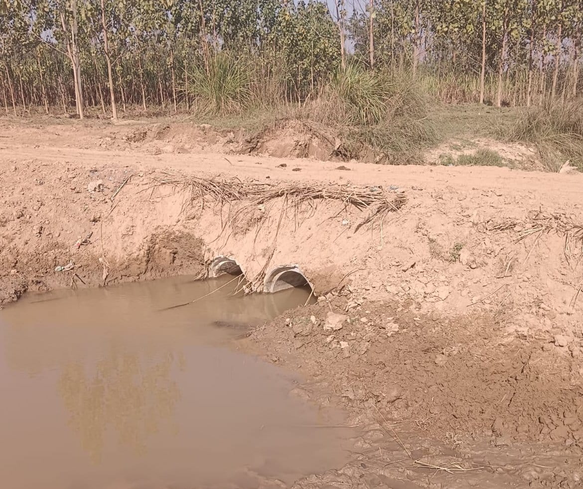 Villagers built a ramp over the Lakdahan river.