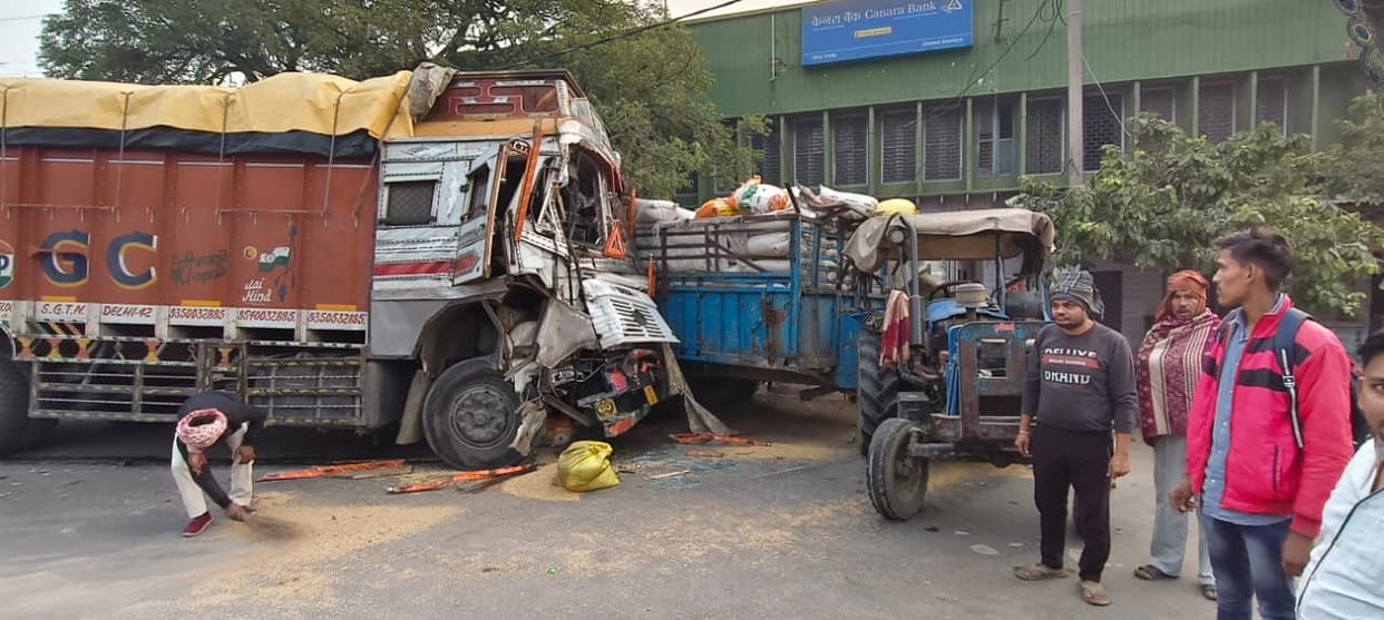 Truck driver injured in collision with tractor