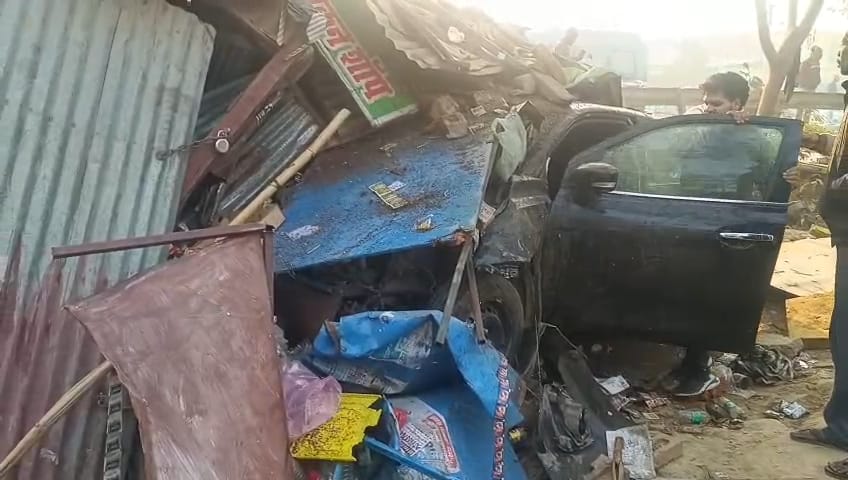 The car hit the businessman and entered the kiosk.