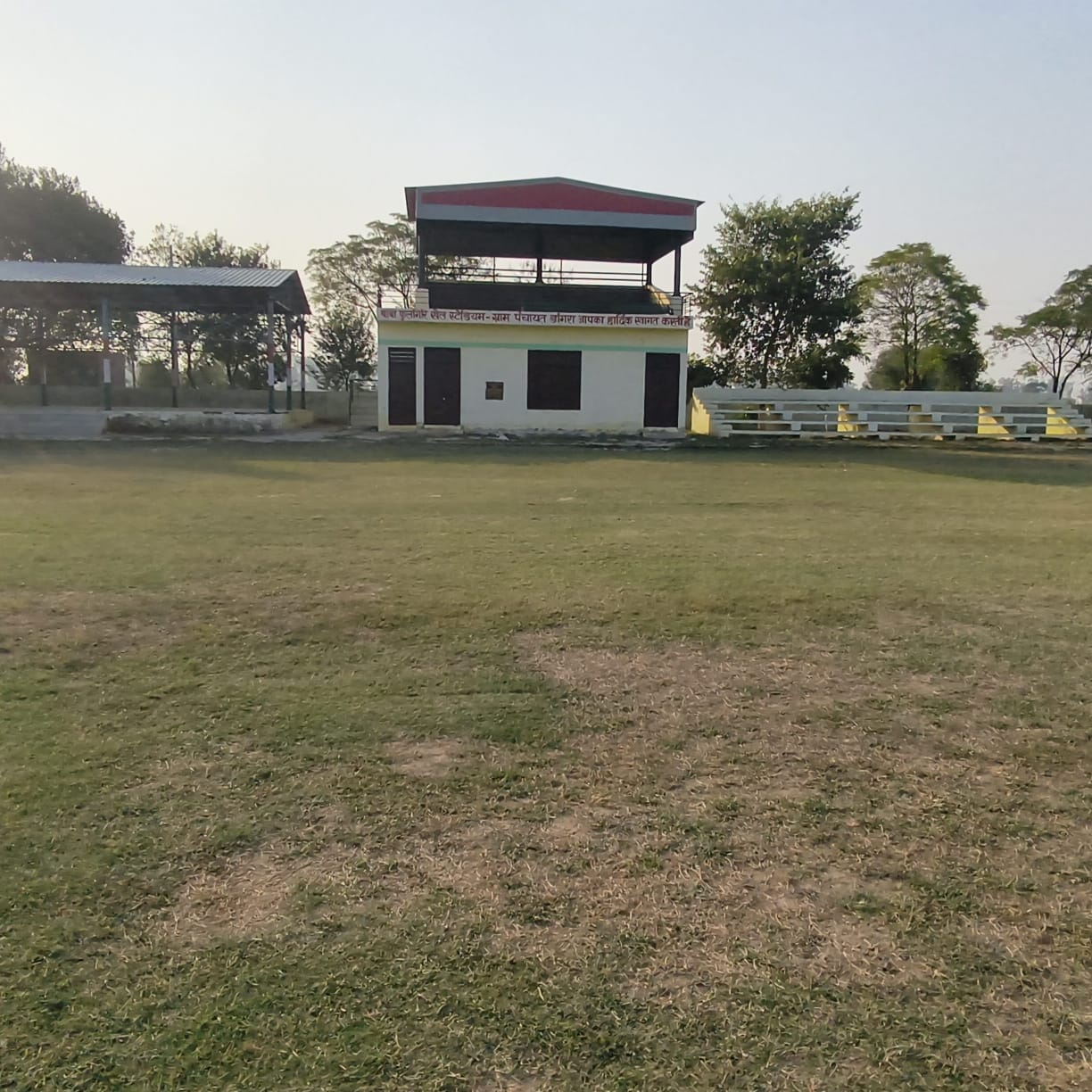 The stadium in Dangra lacks electricity and water, and players are busy honing their talents