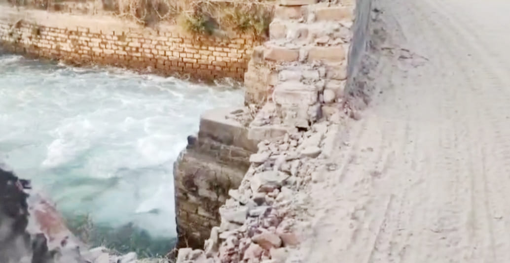 Damaged bridge over canal, risk of accident
