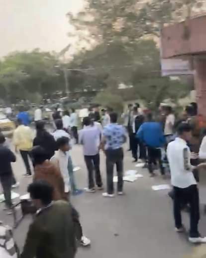 Students and security personnel clashed at the university, leaving two with head injuries.