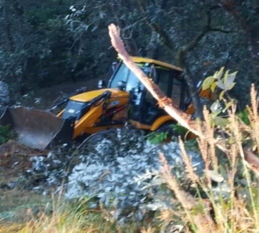 JCB machine falls into ditch during road cutting, helper dies