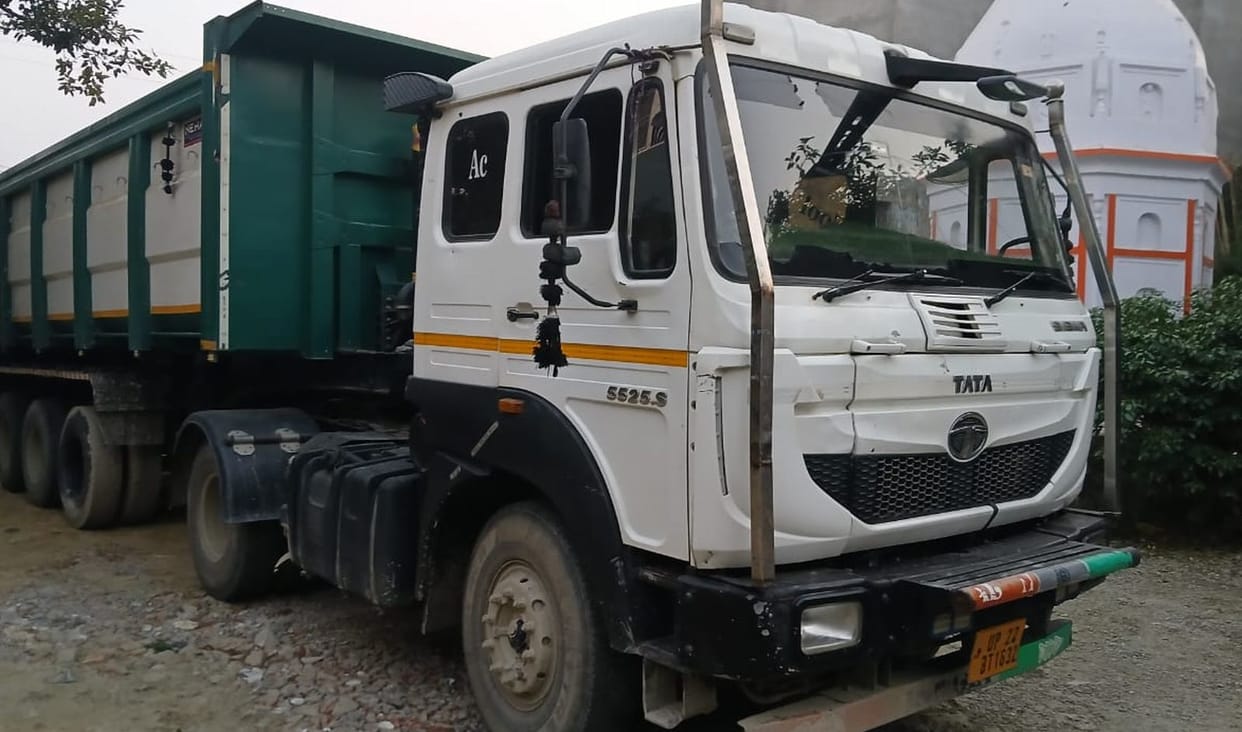 The signboard was broken, and the driver took the shopkeeper away in a truck after he protested.