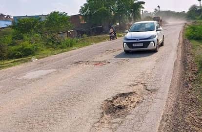 The highway is lined with potholes, and in many places, there is no sign of the road.