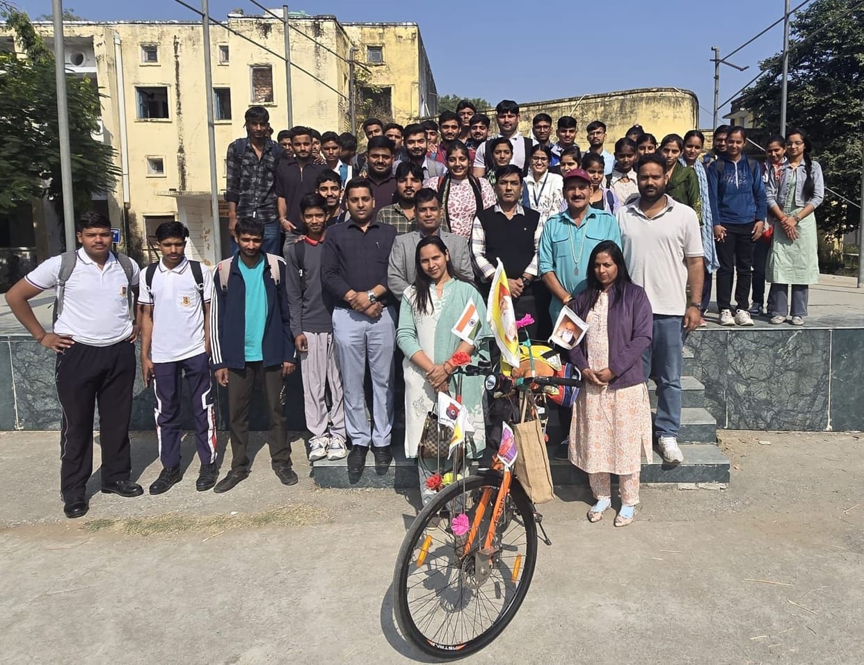 Social workers on a bicycle tour of India arrive at college