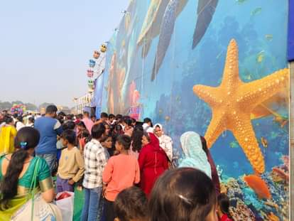 Mermaid: Doing acrobatics in a glass tank and shaking hands with youth