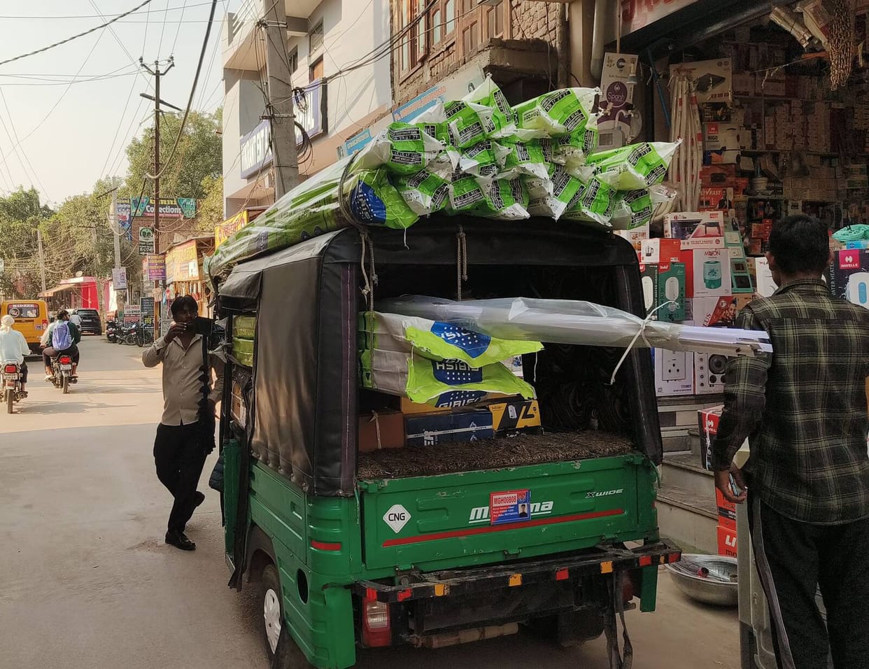 Passengers being crammed from the footboard to the roof