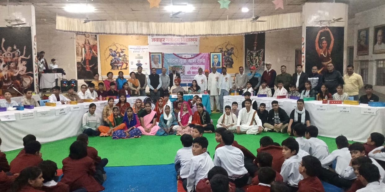 In the Model Youth Village Assembly, student Rajesh became the Sarpanch and Sapna became the Village Secretary.