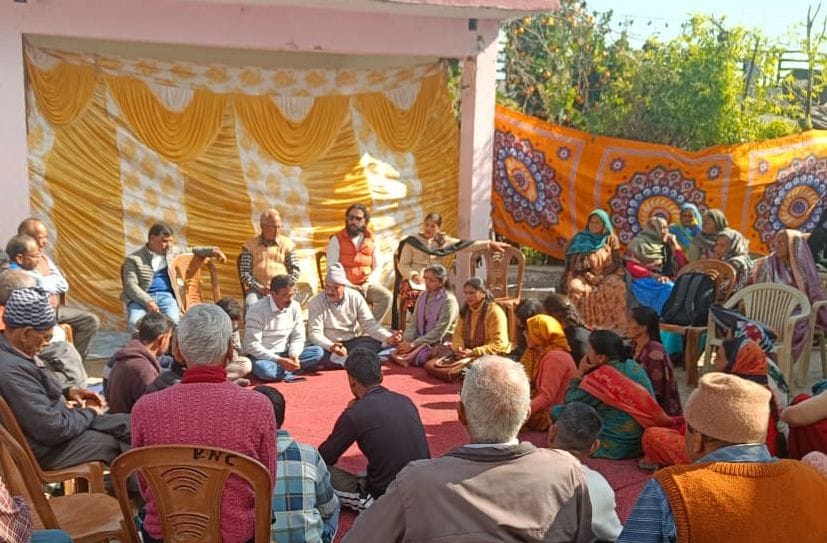 The officials listened to the problems of the villagers by organizing a Chaupal.