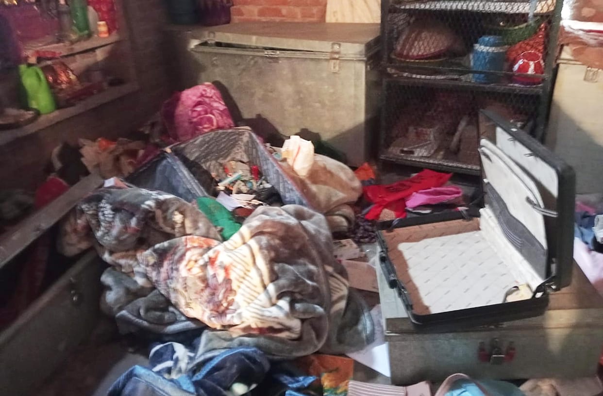 While the family slept, thieves stole cash and jewellery from two houses.