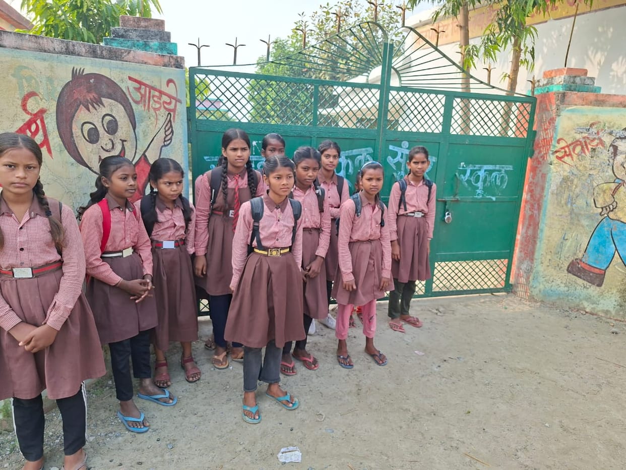 Haibatpur Composite School was supposed to open at 8:30 a.m., but remained closed until 9:30 a.m. Children waited outside.