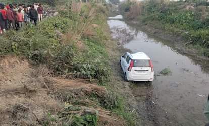 Car hits cyclist and falls into canal