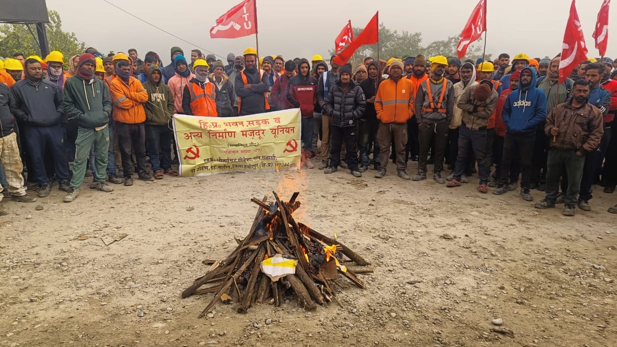 Protests erupt at Dhaulasidh Project by burning copies of the new labour codes.