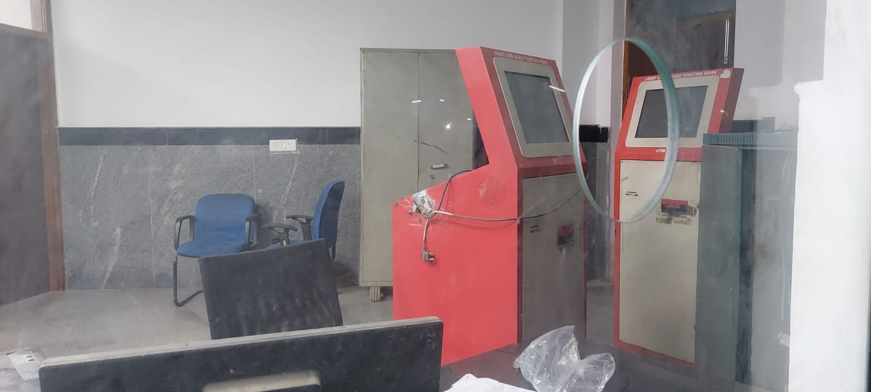 ATMs at ticket counters are closed, leaving passengers waiting in line.