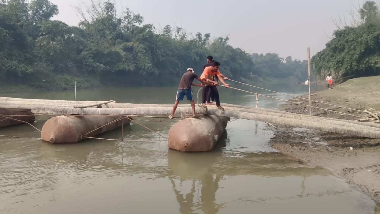Villagers donated their labour and built a pontoon bridge over the Khanuwa River.