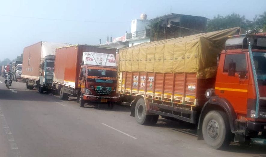 Heavy vehicles remained stranded on the highway, waiting for the diversion to end.