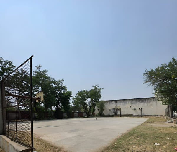 There is no coach in the basketball court, the nets are missing, the surface is also broken.