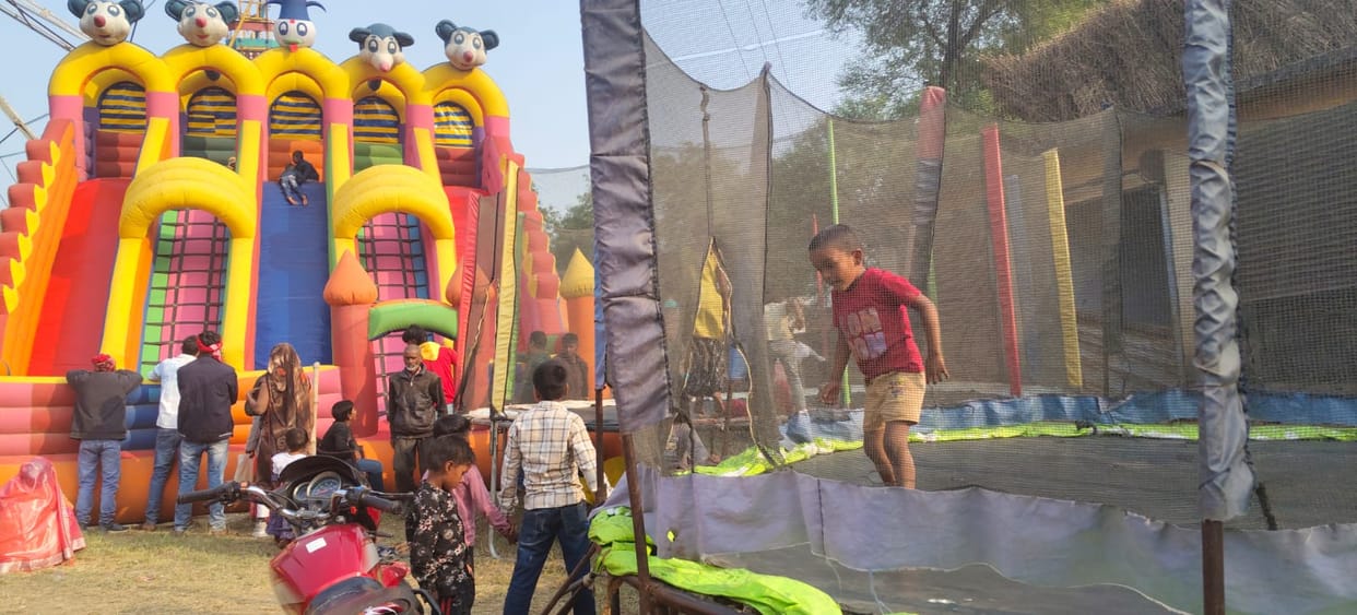 Children and women enjoyed the swings at the Tilhapur fair.