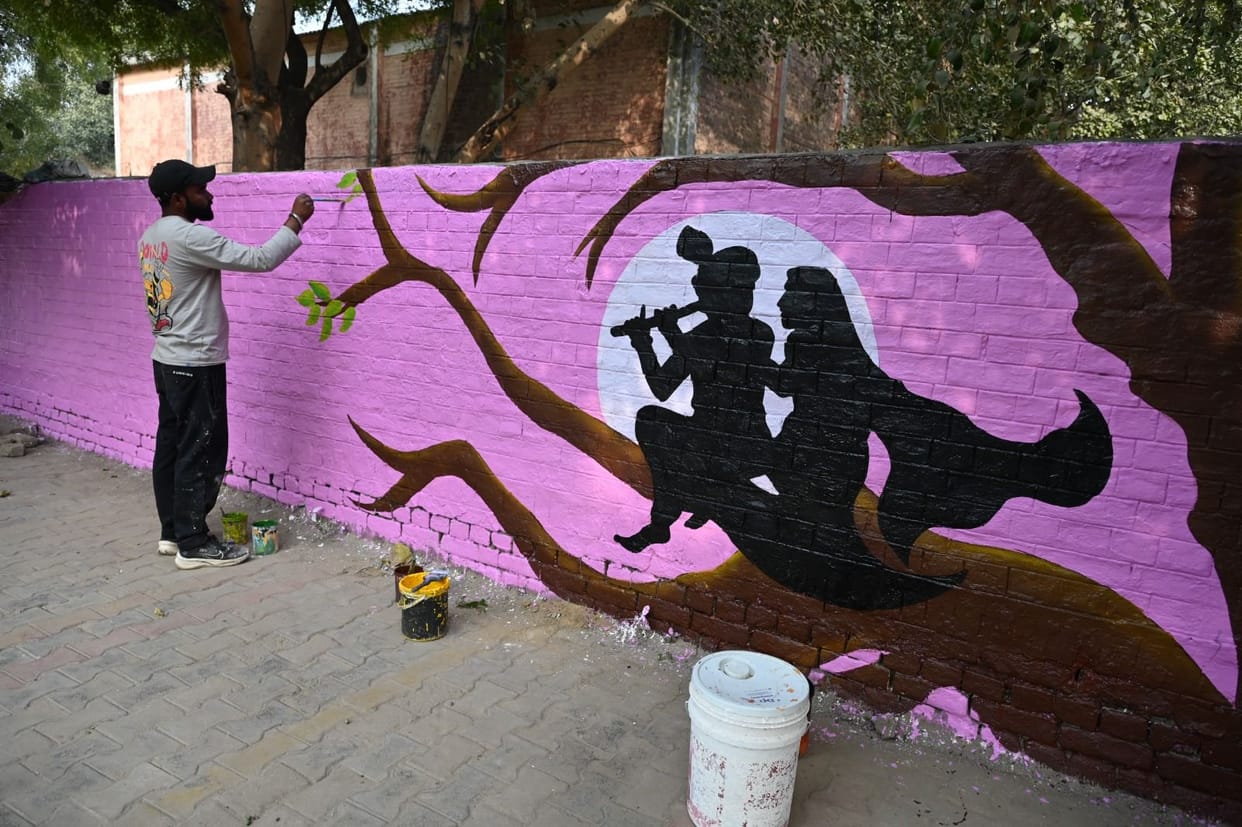 Painters in Punjab are painting Lord Krishna and the message of the Gita on the walls.