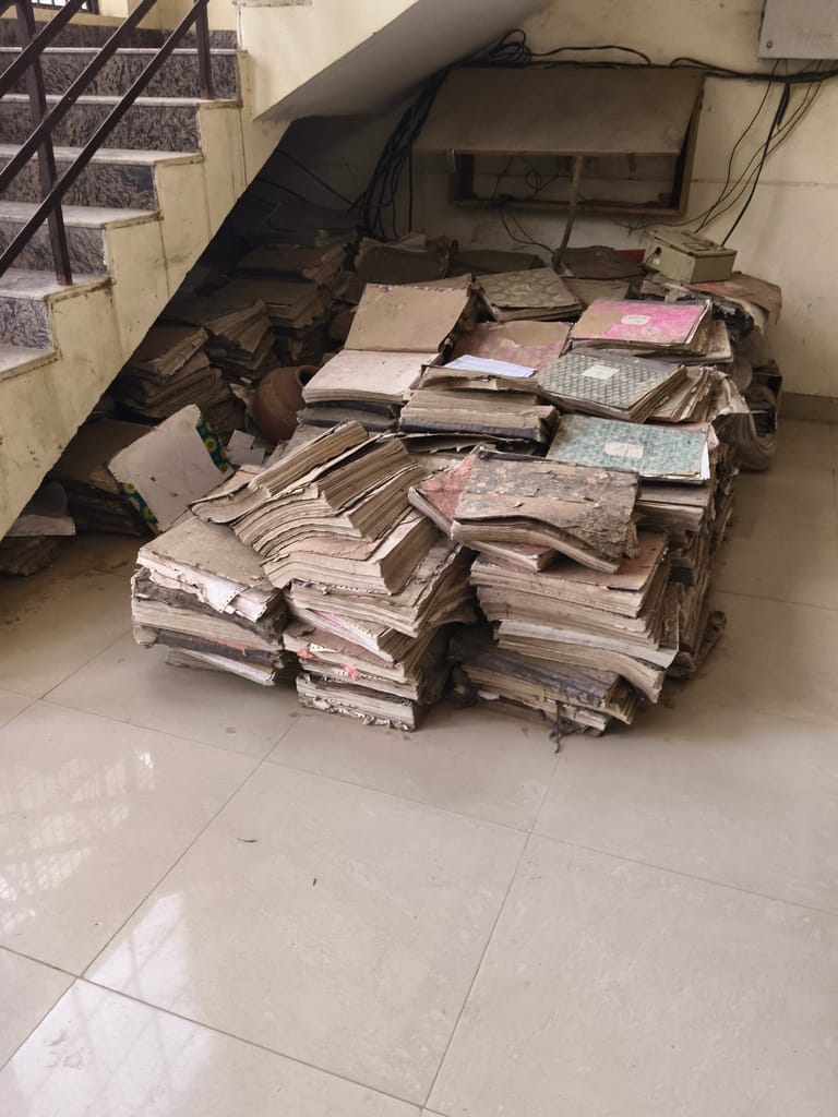 A pile of files was placed near the exposed wires.