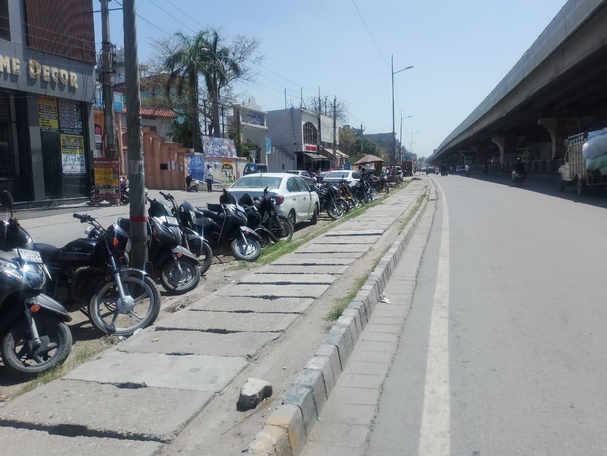 Bikes and cars are being parked illegally in the service lane on GT Road.