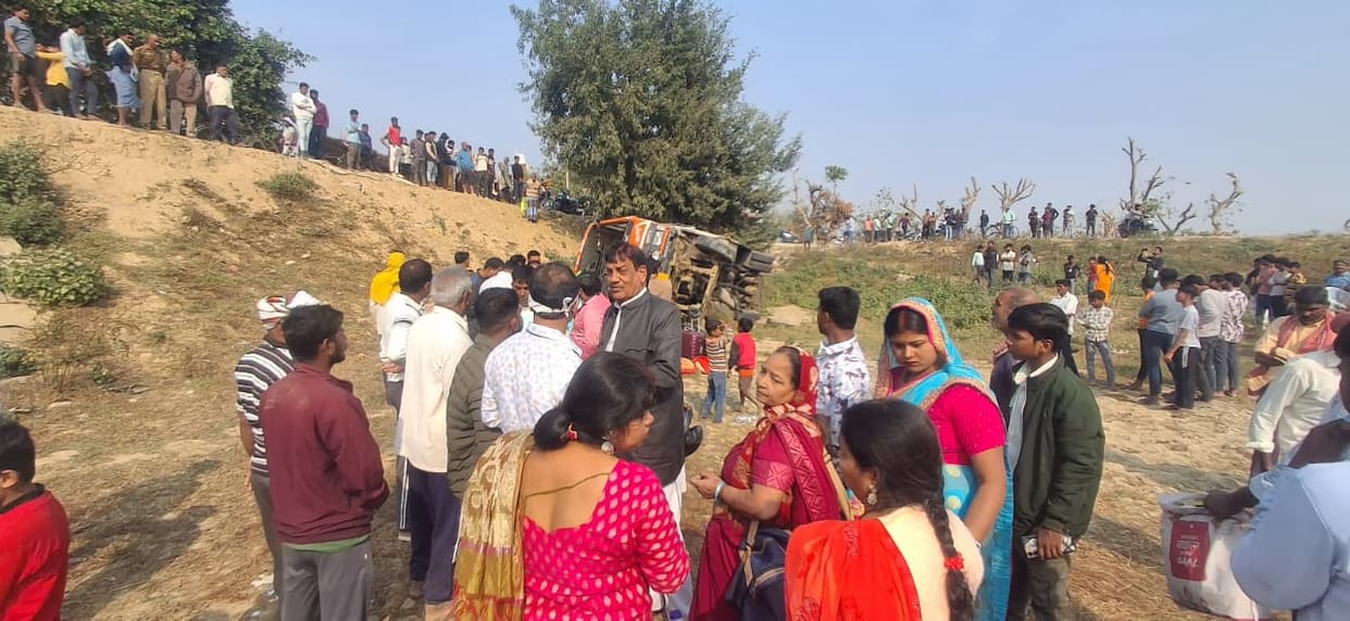 A bus carrying people to a wedding falls into a ditch, injuring 12.