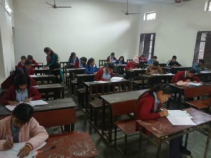 2015 students appeared for the NMMS exam, 233 were absent.