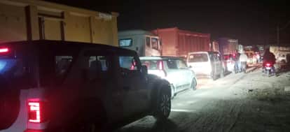 The traffic jam has disturbed the sleep of the people living on the roadside.