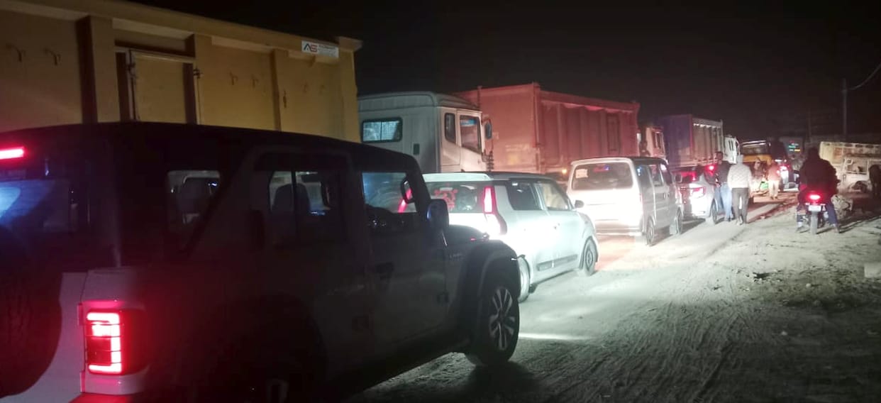 The traffic jam has disturbed the sleep of the people living on the roadside.