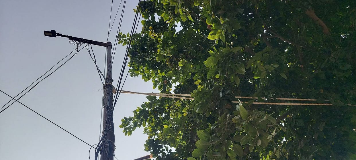 The dilapidated electric pole tilted, causing danger of accident