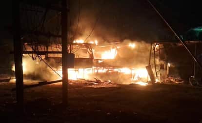 Bus fuel tank catches fire after collision with truck