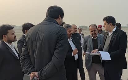 Judicial officers inspected the land marked for the court.