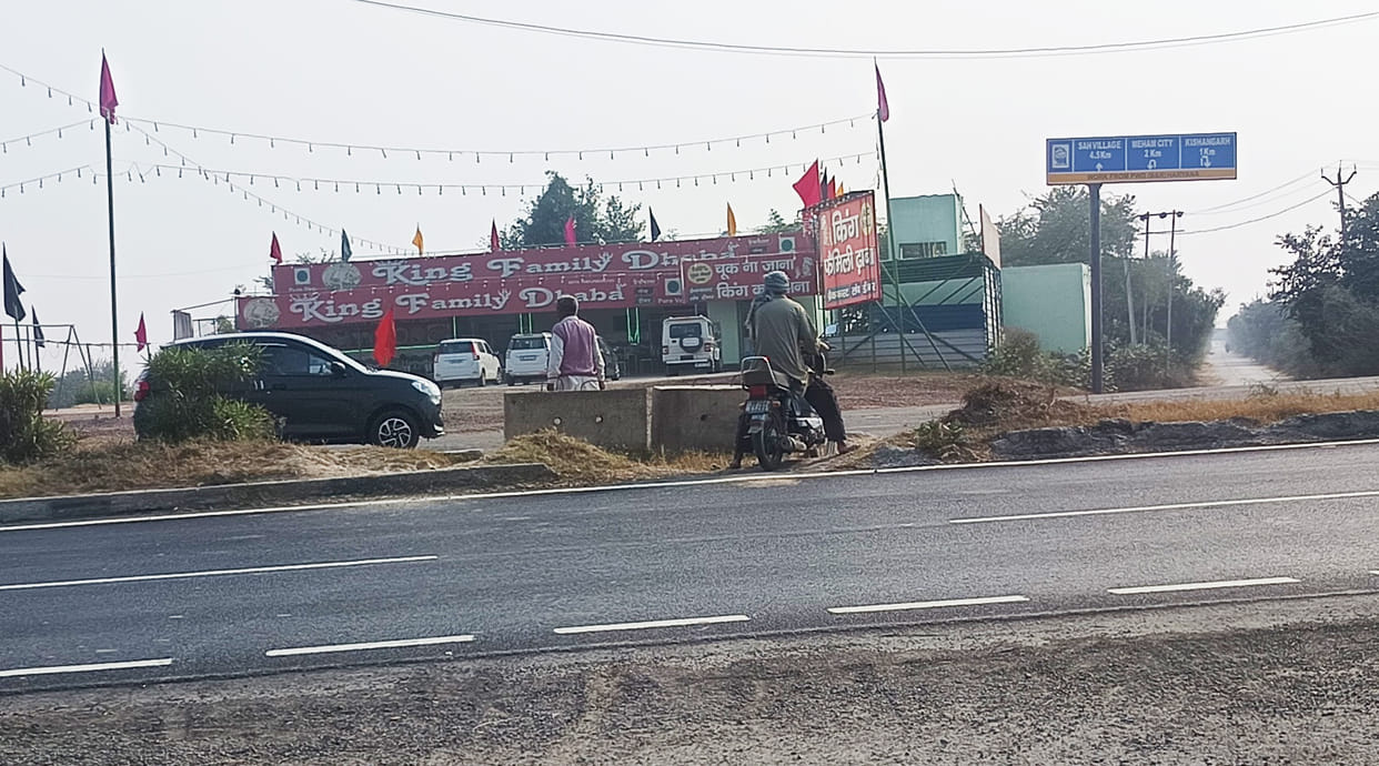 The Delhi-Hisar National Highway has poles but no lights, and the white strip near Sampla is blurred.