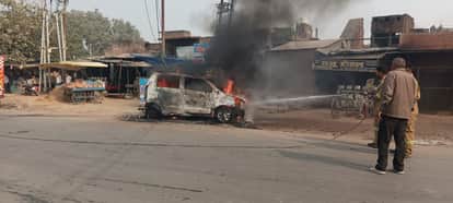 Car catches fire at intersection, four people including driver survive