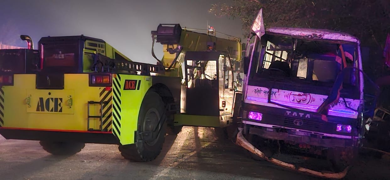 A bus carrying devotees returning from a religious gathering collided with a divider and overturned, injuring six.