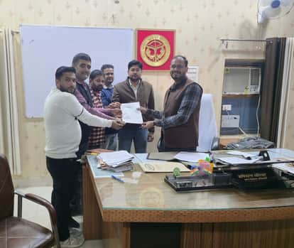 Secretaries and village development officers protested by wearing black bands.