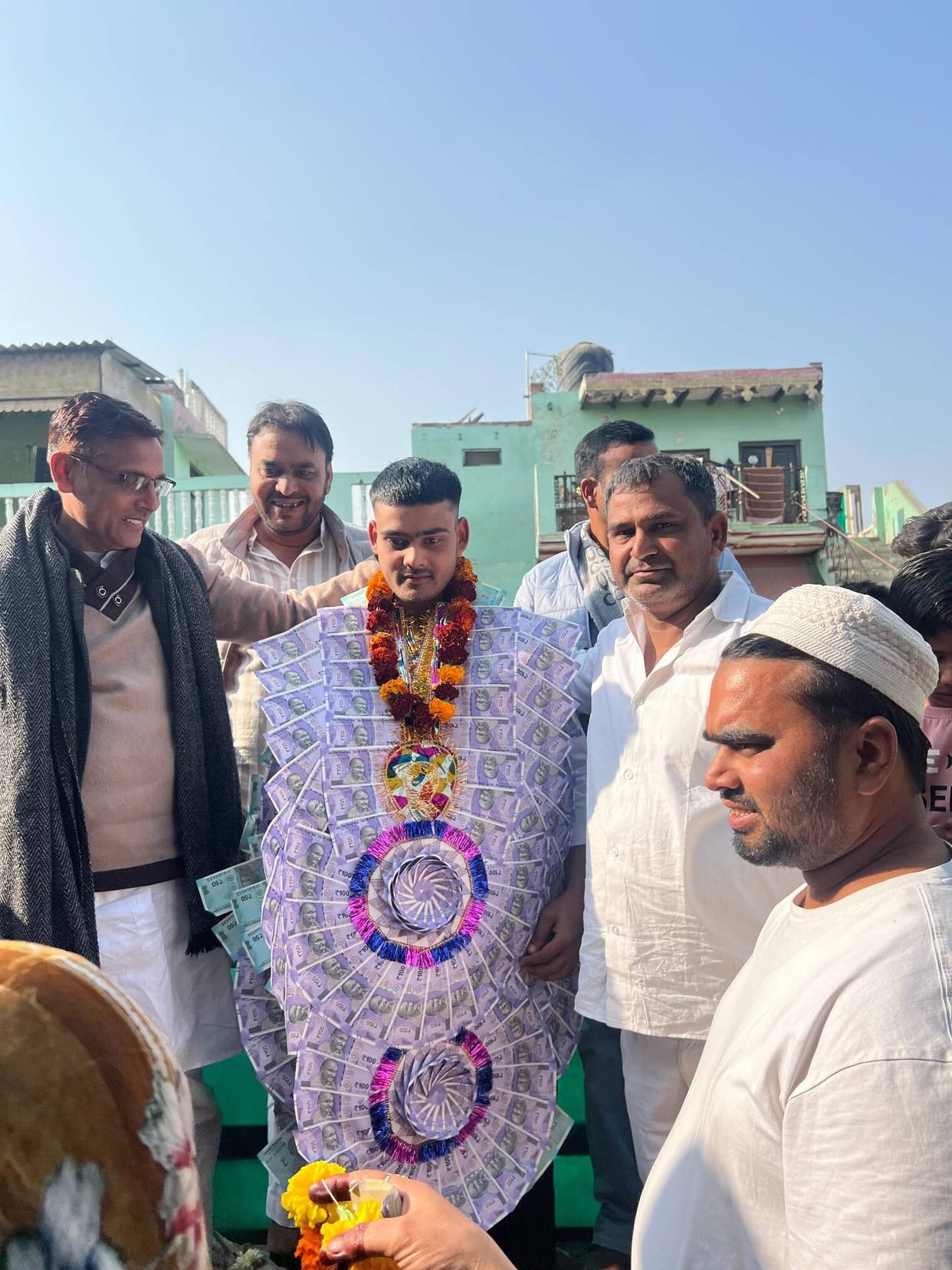 A young man selected for the Indian Army was garlanded and sent off for training.