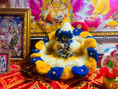Warm clothes being worn for Laddu Gopal and Radha-Rani