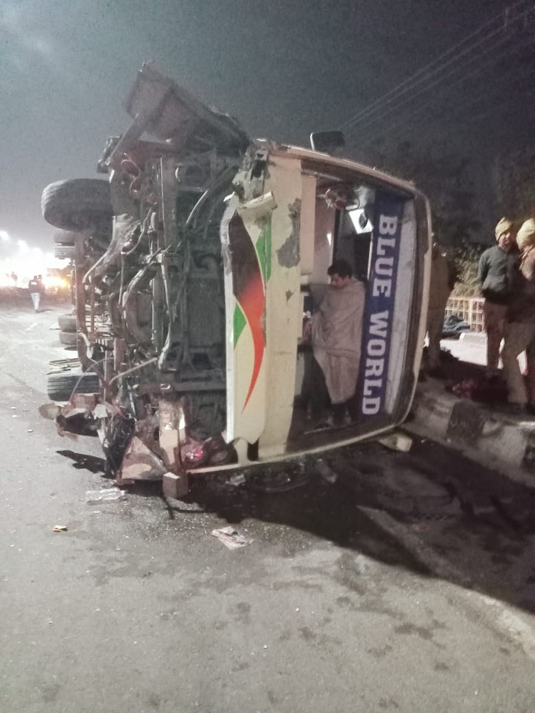 Bus full of passengers hits divider and overturns, 11 injured