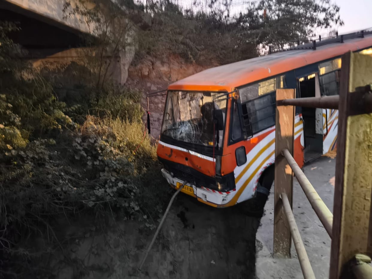 Bus hangs from bridge due to steering failure, passengers have narrow escape
