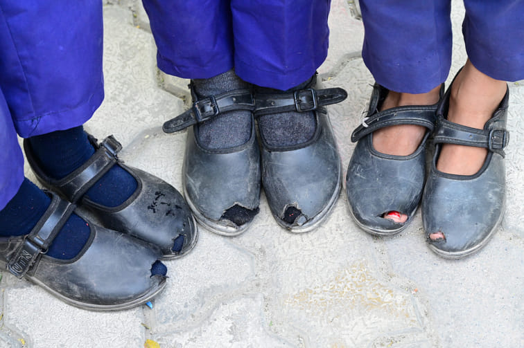 The police-like nature of the system has increased the distance from comfort, helplessness is visible in the torn shoes of children in school.