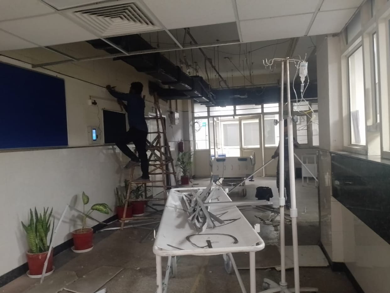 Repair work underway in the emergency ward of the district civil hospital, patients upset