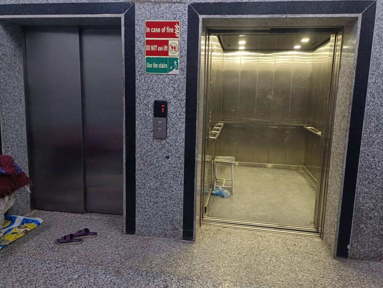 The lift is out of order, leaving patients and attendants gasping on the stairs.