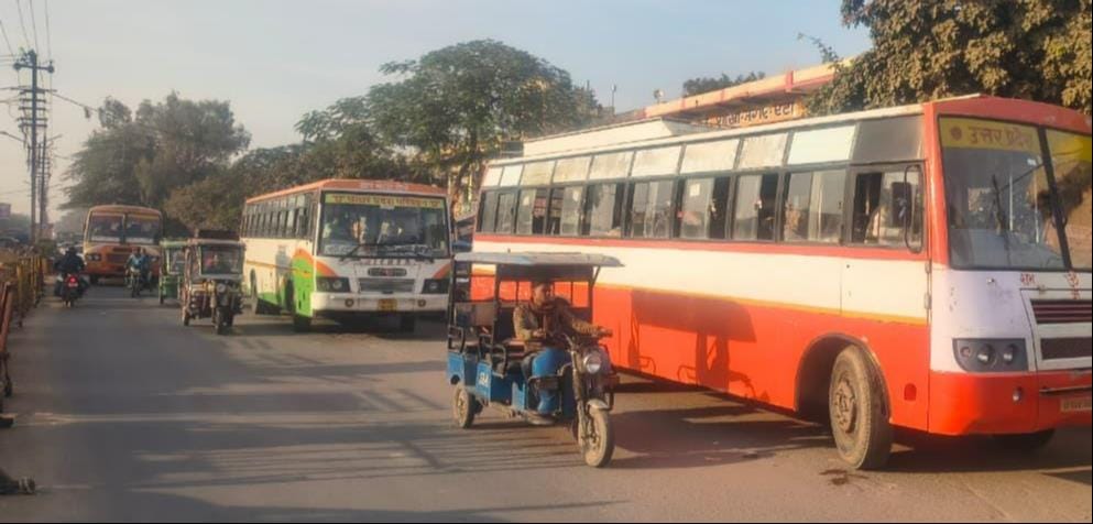 Buses on the road, vehicles stuck in traffic jam