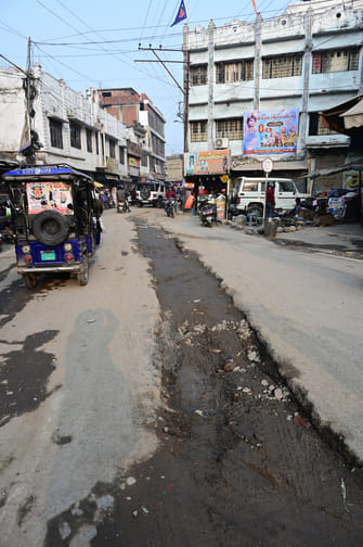 Manholes are raised half a foot above the road at Bottle Neck