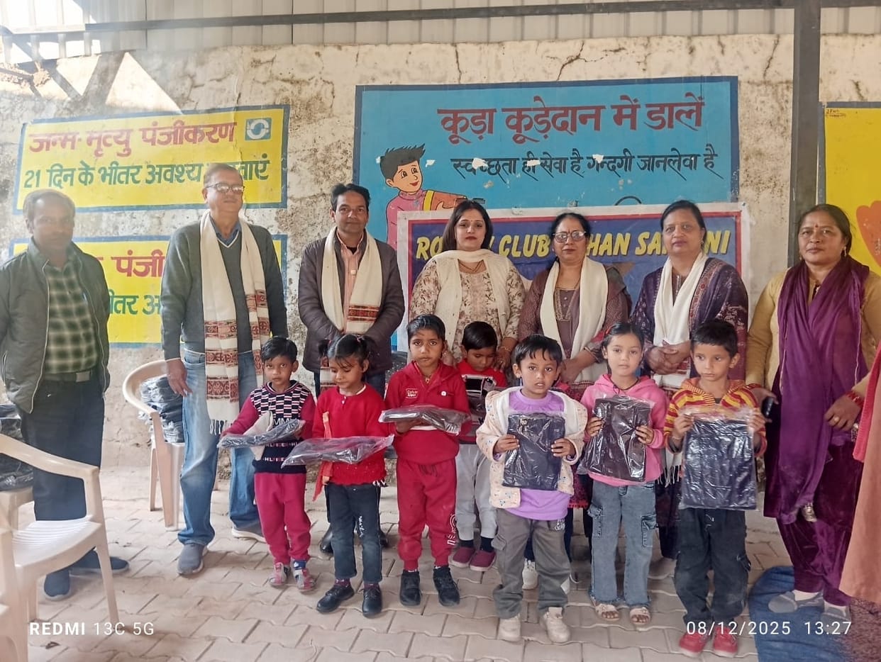 rotary sangni distributed sweator to children