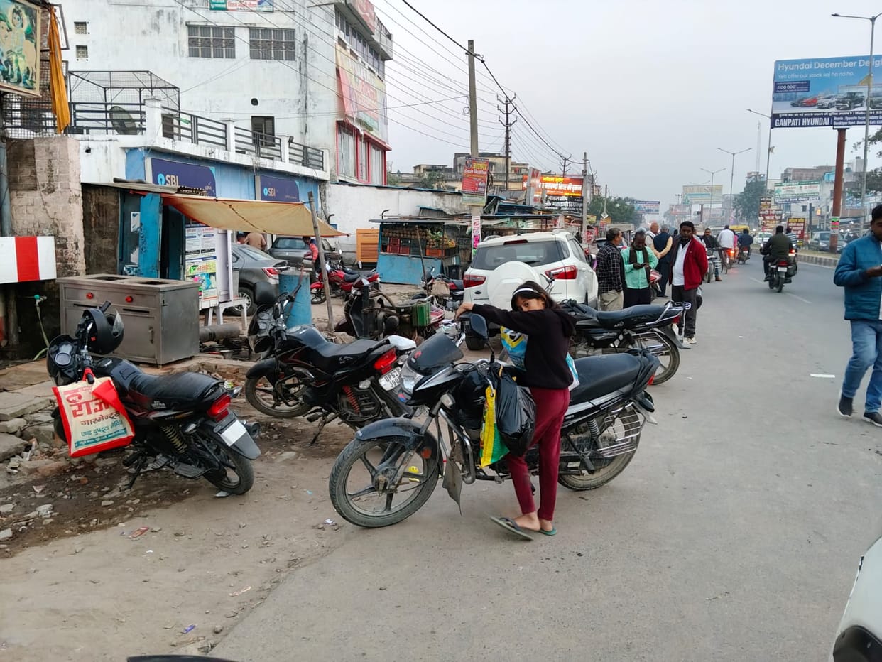 There is no parking arrangement, vehicles are parked on the road...daily traffic jam
