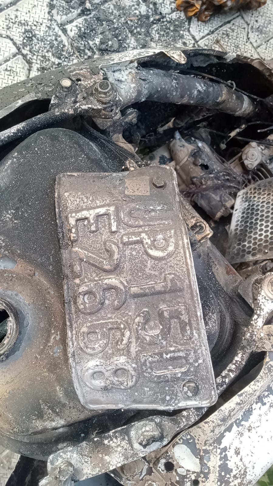 The victim's scooter was found burnt in a sugarcane field.